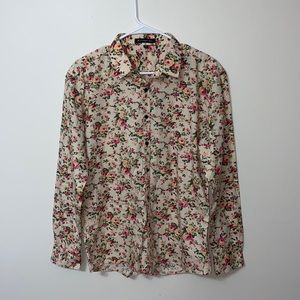 A small long sleeve dress shirt, button down